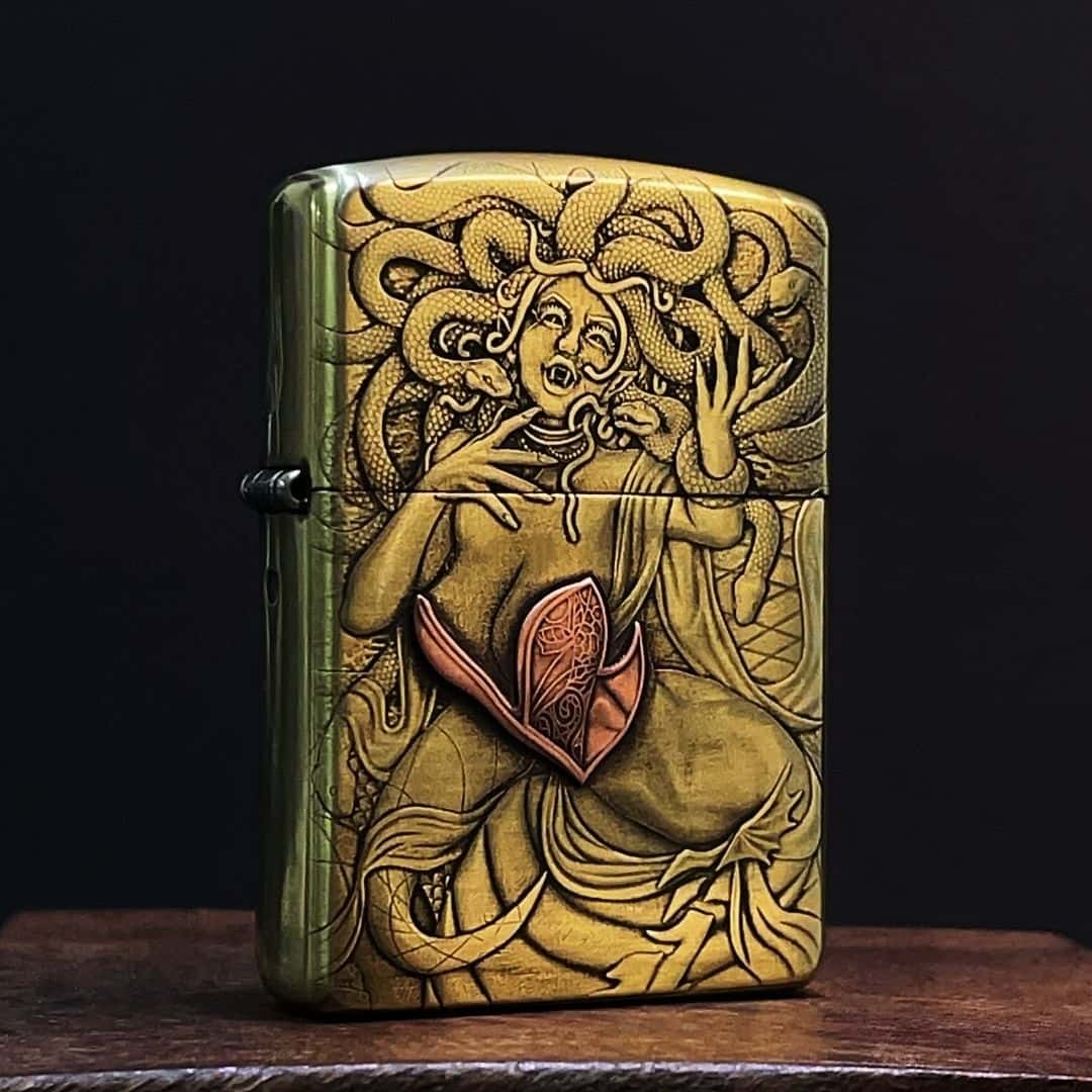 Vinember Medusa deep relief engraved solid brass lighter front view
