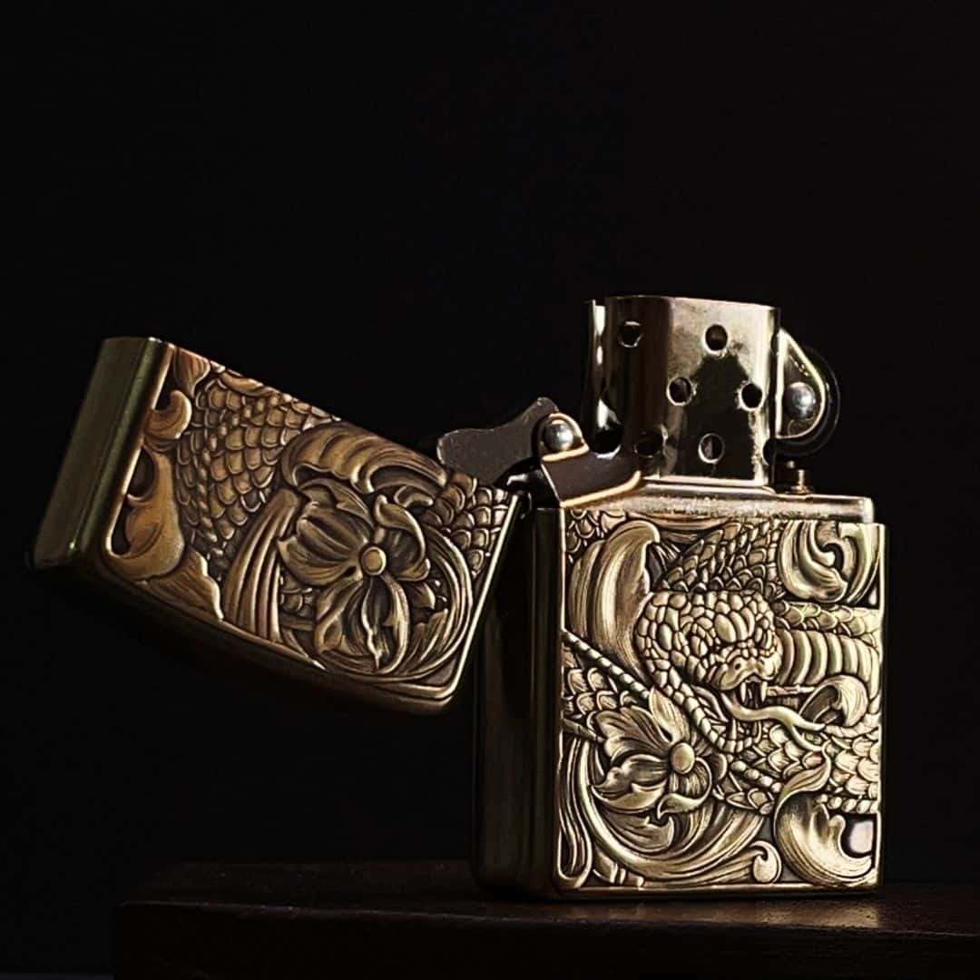 Side profile view of dragon‑lotus engraved vintage brass pocket lighter for EDC