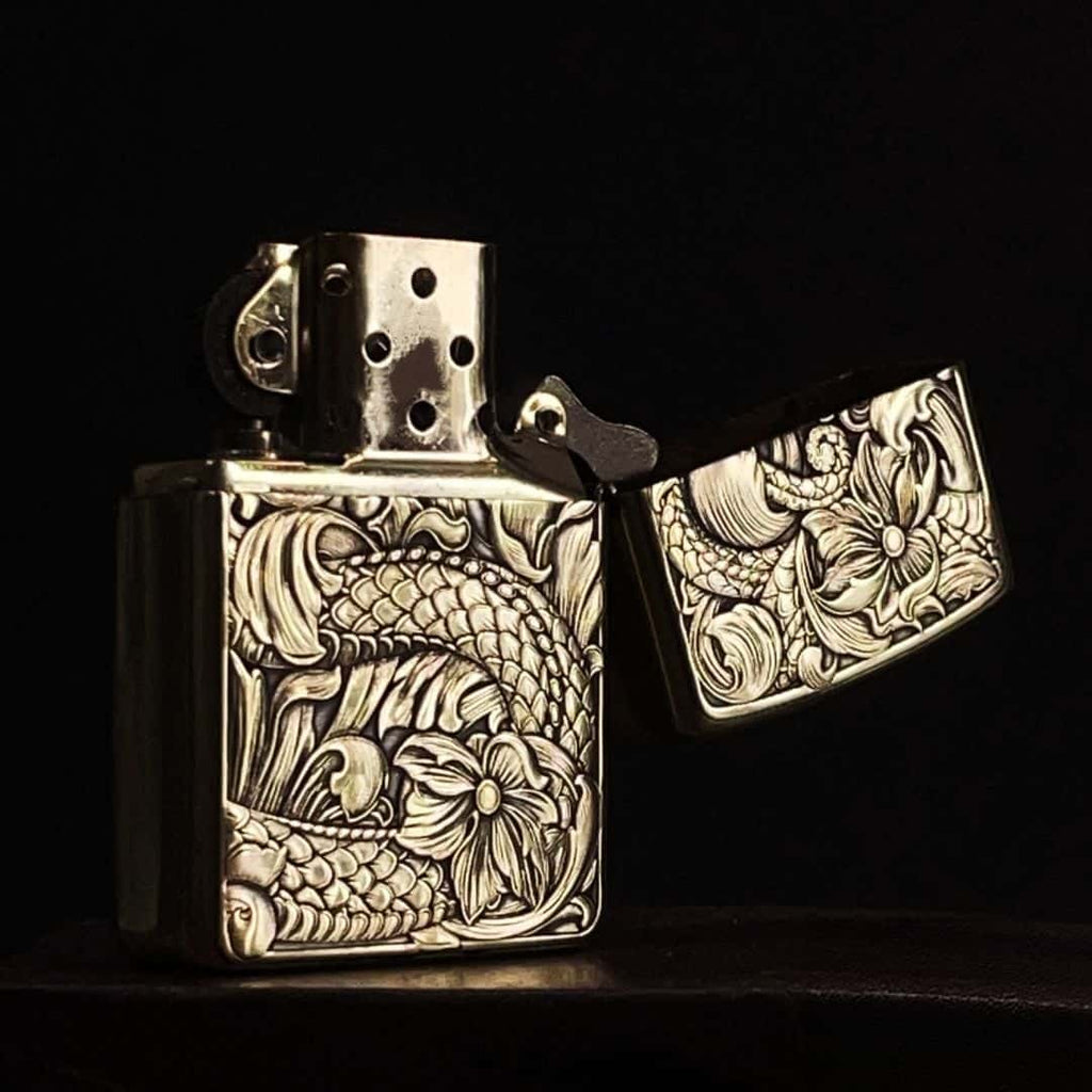 Open view showing inner mechanism of dragon lotus carved brass petrol lighter