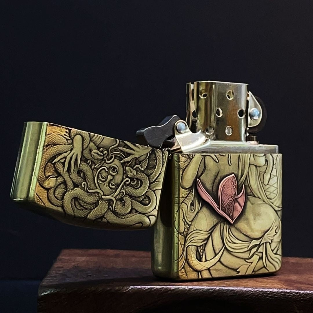 Close‑up shot of intricate Medusa snake‑hair 3D carving on brass lighter